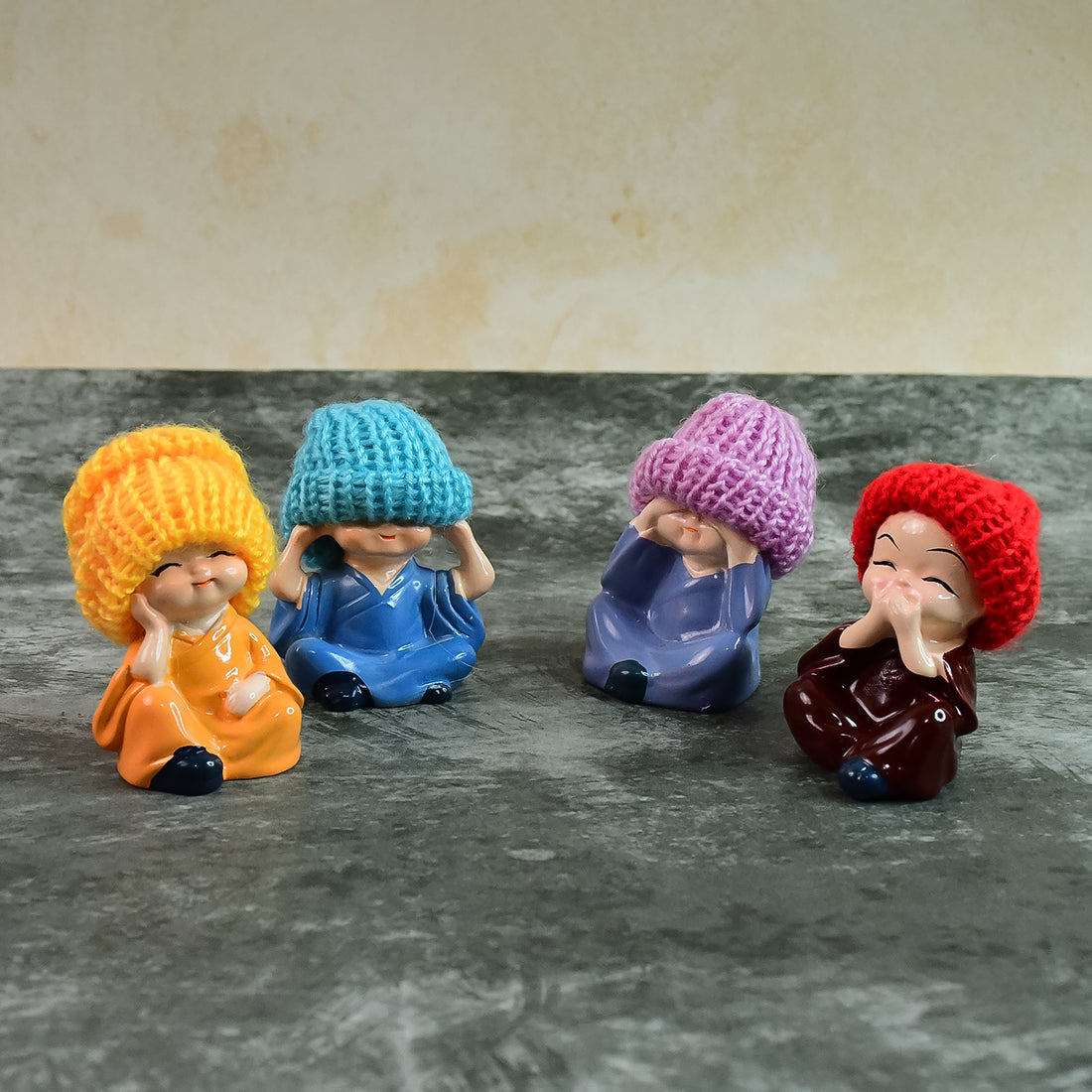Decorative Resin Monk Buddha Showpiece Set of 4 with Straw Hats