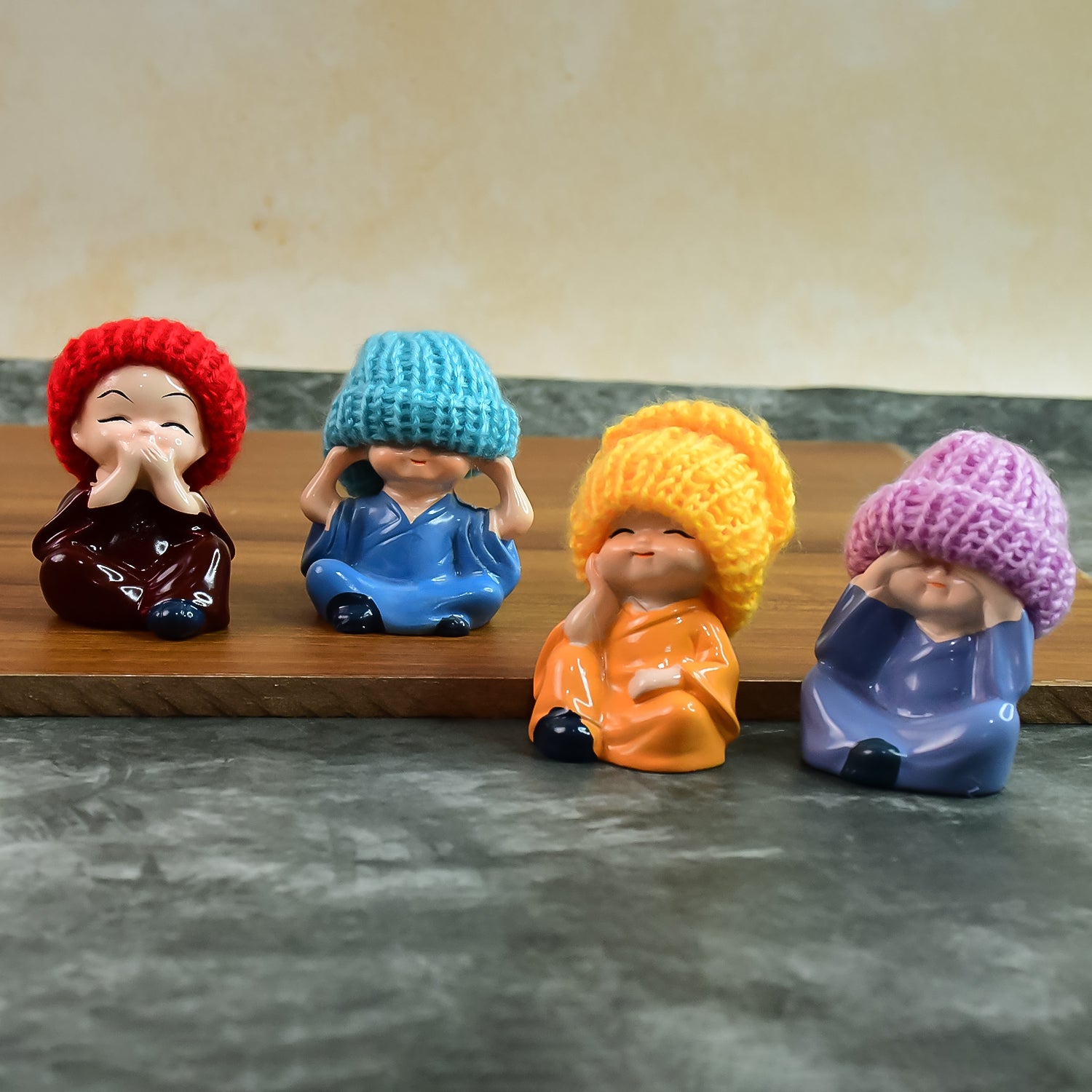 Decorative Resin Monk Buddha Showpiece Set of 4 with Straw Hats