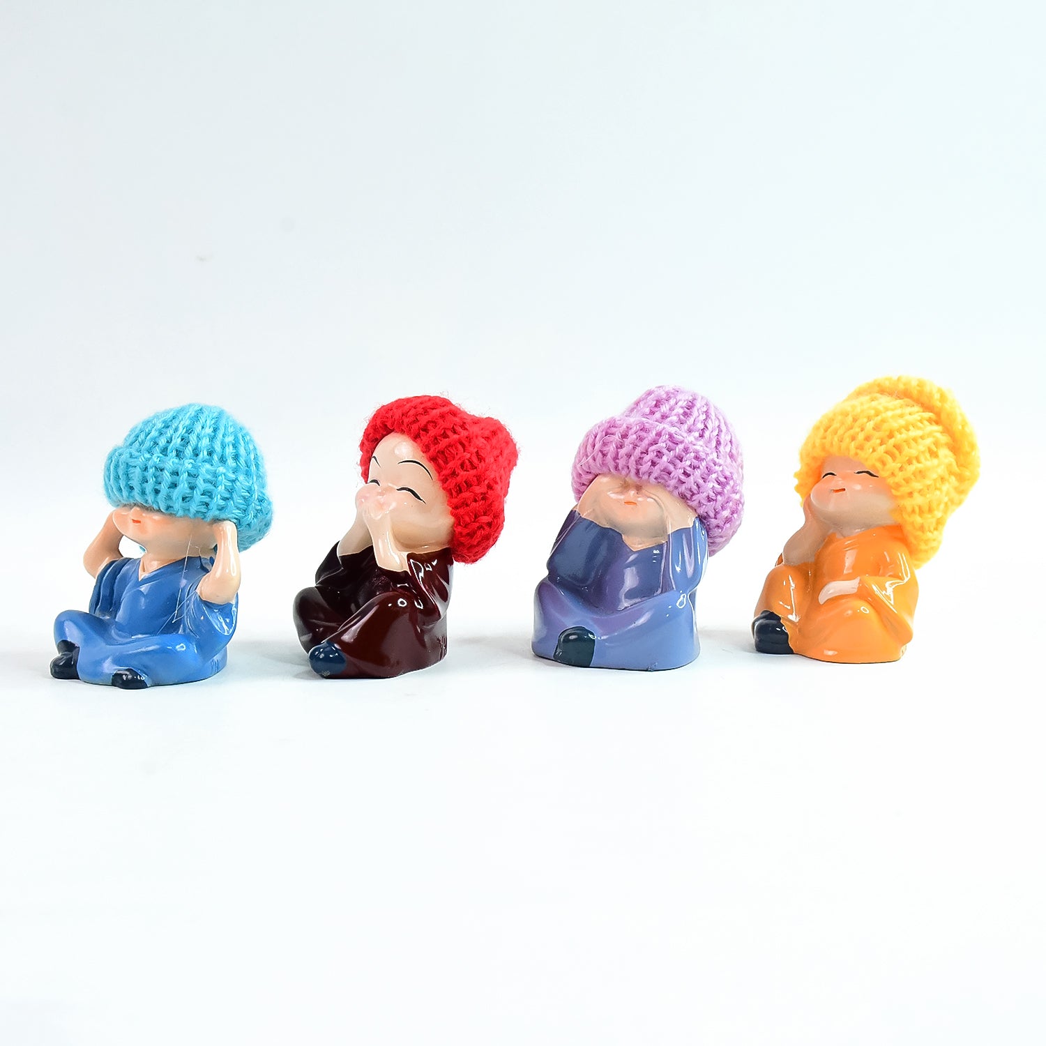 Decorative Resin Monk Buddha Showpiece Set of 4 with Straw Hats